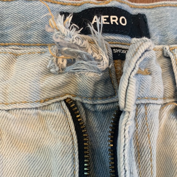 AERO High Rise Shorty Light Wash Distressed Raw Edge Frayed Denim Shorts - Picture 3 of 6